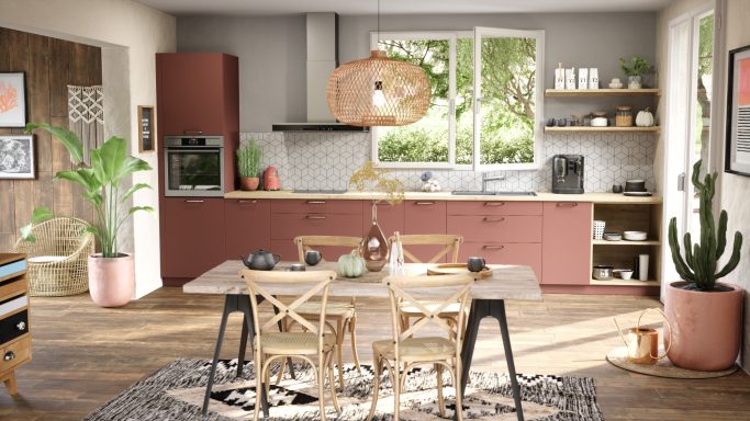 Cuisine moderne et lumineuse avec table en bois, plantes et accents colorés.