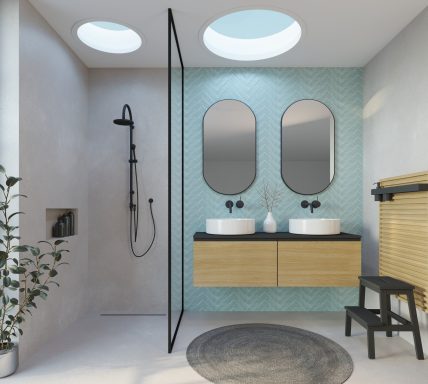 Salle de bain moderne avec deux lavabos, douche ouverte et lumière naturelle.